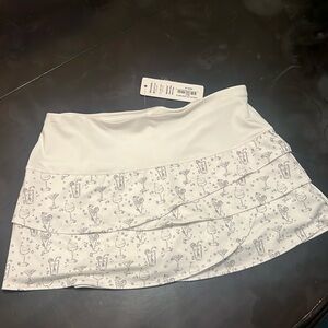 Athletic skort -  white with wine/drinks print.  Size medium.  New not used.
